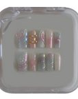 Girlhood: Pastel Chrome Nails with Swirl Designs